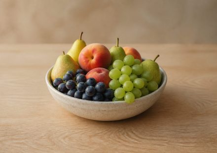 Fresh fruits bowl on wooden table - illustration for 15 daily habits that boost heart, brain, and overall health naturally