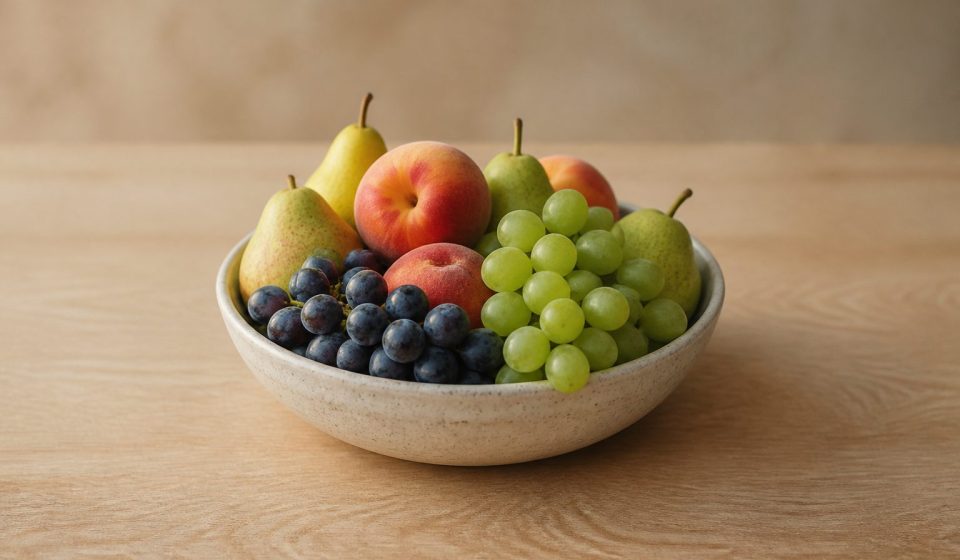 Fresh fruits bowl on wooden table - illustration for 15 daily habits that boost heart, brain, and overall health naturally