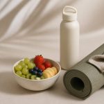 Water bottle yoga mat and fresh fruit bowl - illustration for Building healthy habits for lasting physical and mental wellness