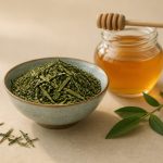 Bowl of fresh green tea leaves and honey jar - illustration for Common Causes of Acne and Effective Treatment Options