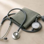 Stethoscope and blood pressure cuff on table - illustration for Health screenings everyone should know for early disease detection