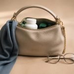 Woman's purse with eyeglasses and vitamins - illustration for Essential Women’s Health Screenings by Age