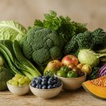 Fresh fruits and vegetables on wooden table - illustration for Fatty Liver Disease: Causes and Prevention