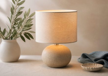 Lamp casting warm light on bedroom table - illustration for How indoor lighting affects your comfort and sleep quality
