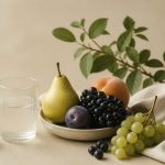 Fresh fruits and a water glass on table - illustration for Lifestyle changes that boost heart health and strength