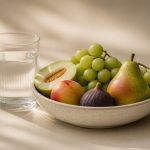 Fresh fruits and a glass of water - illustration for How to maintain good health all year long