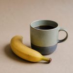 Cup of coffee with a ripe banana - illustration for Morning Habits for Better Health