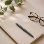 Notepad pen and eyeglasses on table - illustration for Questions to Ask Your Doctor During an Appointment