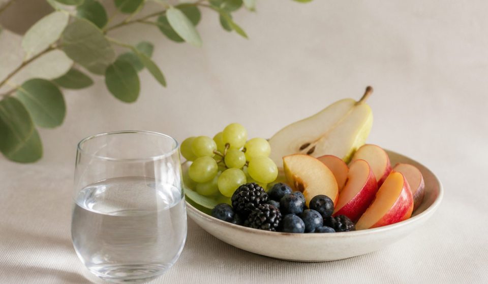 Glass of water and fresh fruit bowl - illustration for How small lifestyle changes can prevent chronic diseases