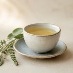 Calm teacup with herbal leaves nearby - illustration for The Link Between Stress and Physical Health: How Chronic Stress Affects Your Body and Well-Being