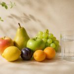 Fresh fruits and a glass of water - illustration for Simple habits to stay healthy between doctor visits