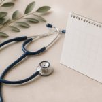 Stethoscope resting next to a calendar page - illustration for why early diagnosis saves lives through timely detection and care